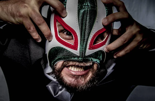 Angry businessman with mask of Mexican fighter — Stock Photo, Image