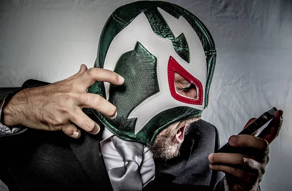 Angry businessman with mask of Mexican fighter — Stock Photo, Image