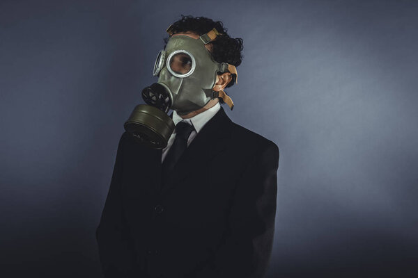 Businessman with gas mask