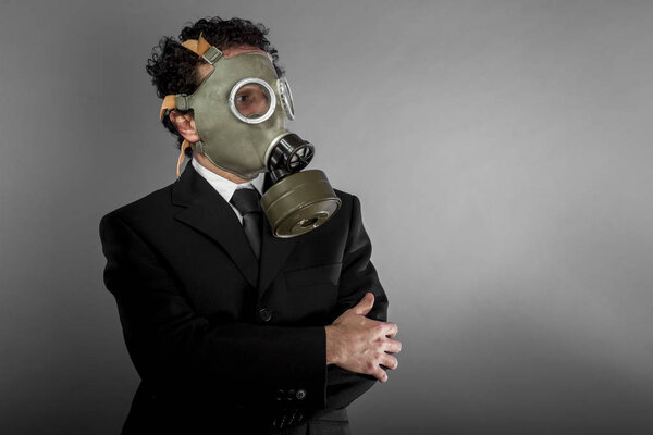 Businessman with gas mask