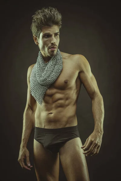 Elegant and muscular man with naked torso and chains — Stock Photo, Image