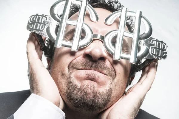 Hombre de negocios con gafas en forma de dólar —  Fotos de Stock