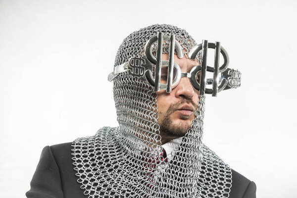 man with medieval chain mail and dollar-shaped glasses