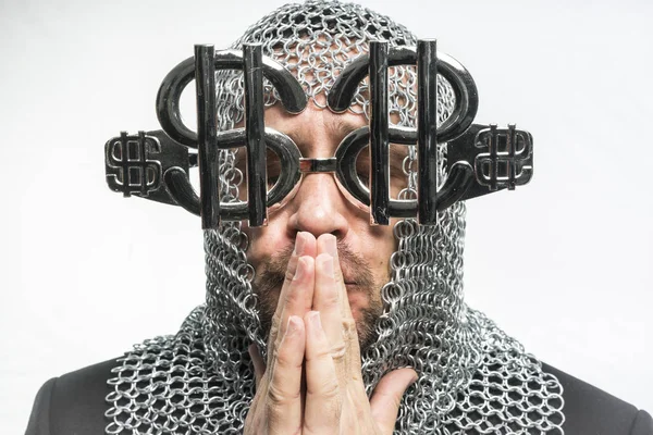 Man with medieval chain mail and dollar-shaped glasses — Stock Photo, Image