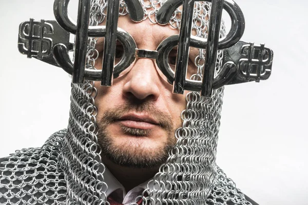 Man with medieval chain mail and dollar-shaped glasses — Stock Photo, Image