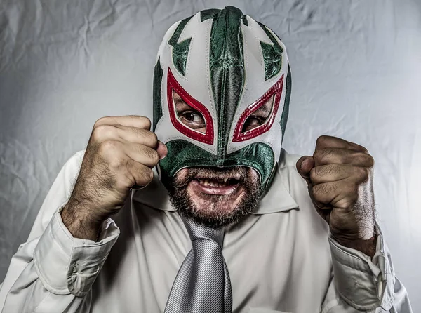 Angry businessman with mask of Mexican fighter