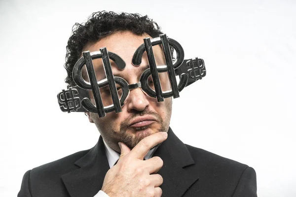 Empresario con gafas con signos de dólar — Foto de Stock