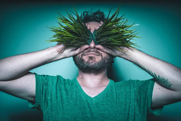 Man with grass in eyes — Stock Photo, Image