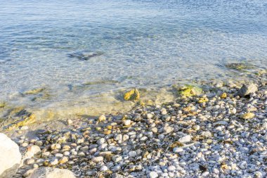 Footprints on the beach of Ibiza island in Spain, holiday and summer scene clipart