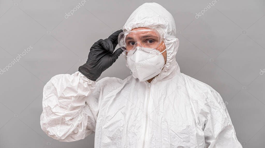 Covid19, Nurse with protective face mask, glasses and sanitary mask. coronavirus and treatment concept on gray and neutral background
