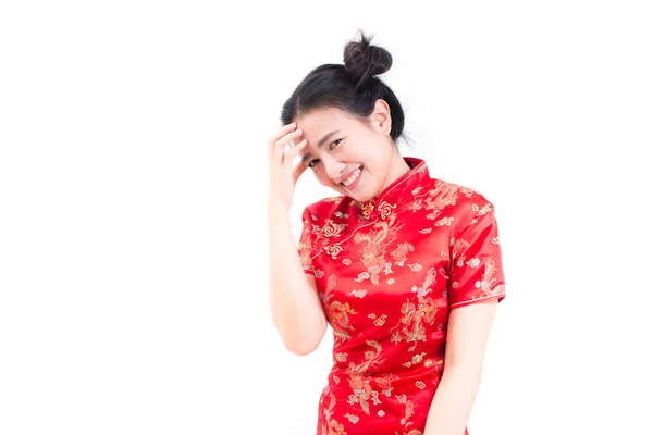 Portrait of a pensive asian woman wearing chinese dress cheongsam with standing and looking at camera. Chinese New Year Festivities, New Year Celebration. on white background. — Stock Photo, Image