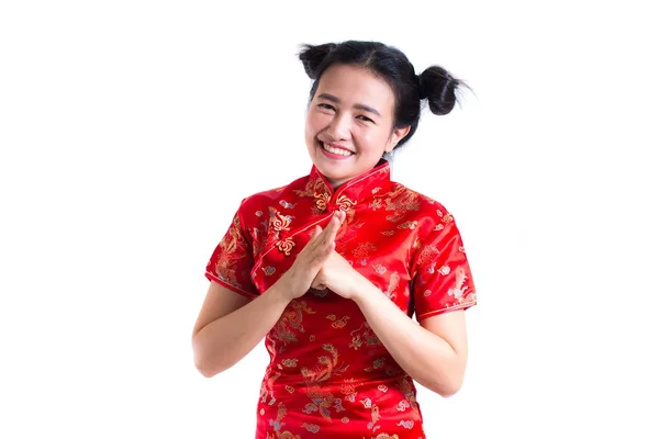 Young asian woman wearing chinese dress traditional cheongsam with gesture of congratulation, Looking at the camera and smile in Chinese New Year Festivities, New Year Celebration on white background — Stock Photo, Image