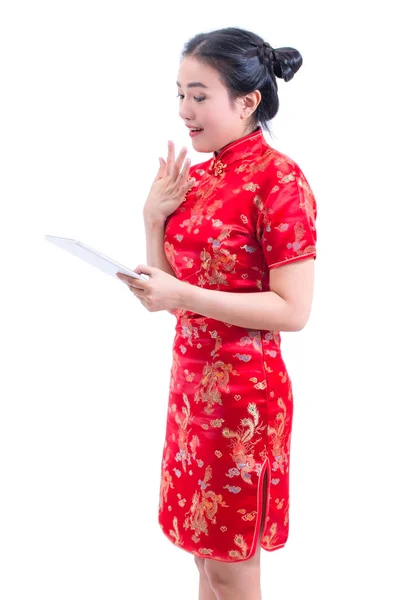 Portrait of Beautiful Young asian woman wear chinese dress traditional cheongsam or qipao using modern digital tablet with open-mouthed. shocked facial expression surprised, digital online, technology — Stock Photo, Image