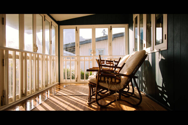 Positive thinking concept. Wicker chairs or Rattan chair Light of the old wooden windows falls on Wicker chairs or Rattan chair in an abandoned building, cinematic, wicker chair empty, empty room.