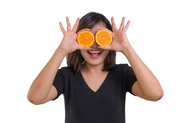 Portrait of young Asian woman wear black shirt. holding orange slices in front of her eyes and smile isolated on white background. Healthy food concept. Diet concept. Woman want body perfect — Stock Photo, Image