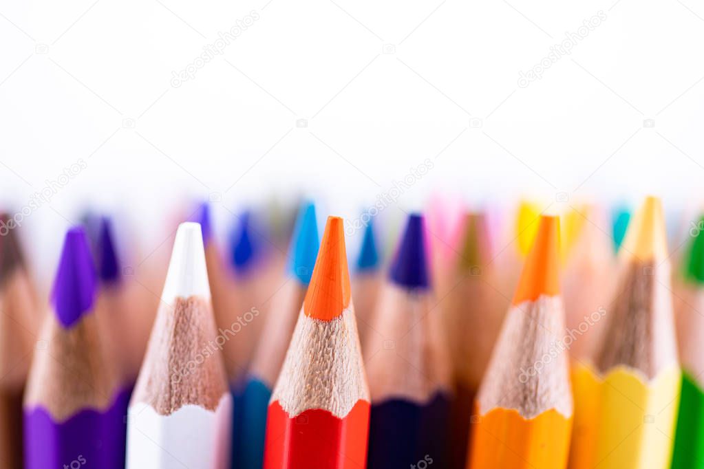 Close up seamless colored pencils row isolated on white background. Colorful pencils with copy space for your text.