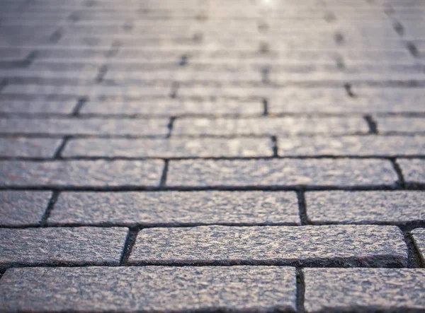 Fondo texturizado de una piedra pavimentada — Foto de Stock