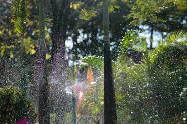 Water spray to bokeh. — Stock Photo, Image