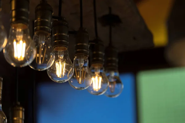 Incandescent light bulb in the row — Stock Photo, Image