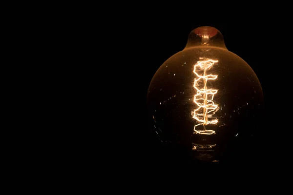 Spiral incandescent light with the round shape bulb — Stock Photo, Image