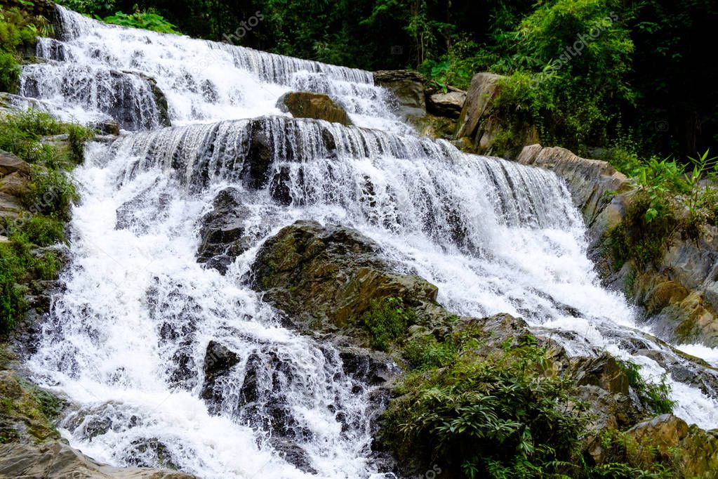 Strong flow water from Mae Phun waterfalls in Laplae District, Thailand