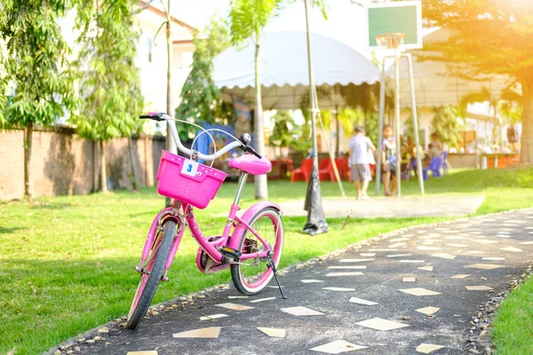 Bicycle in the playground with soft orange light