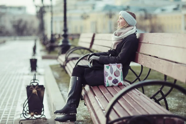 Dreaming woman in winter city