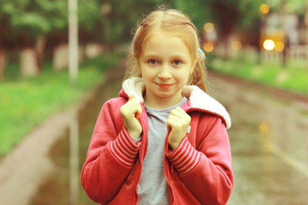 cute girl under Spring rain