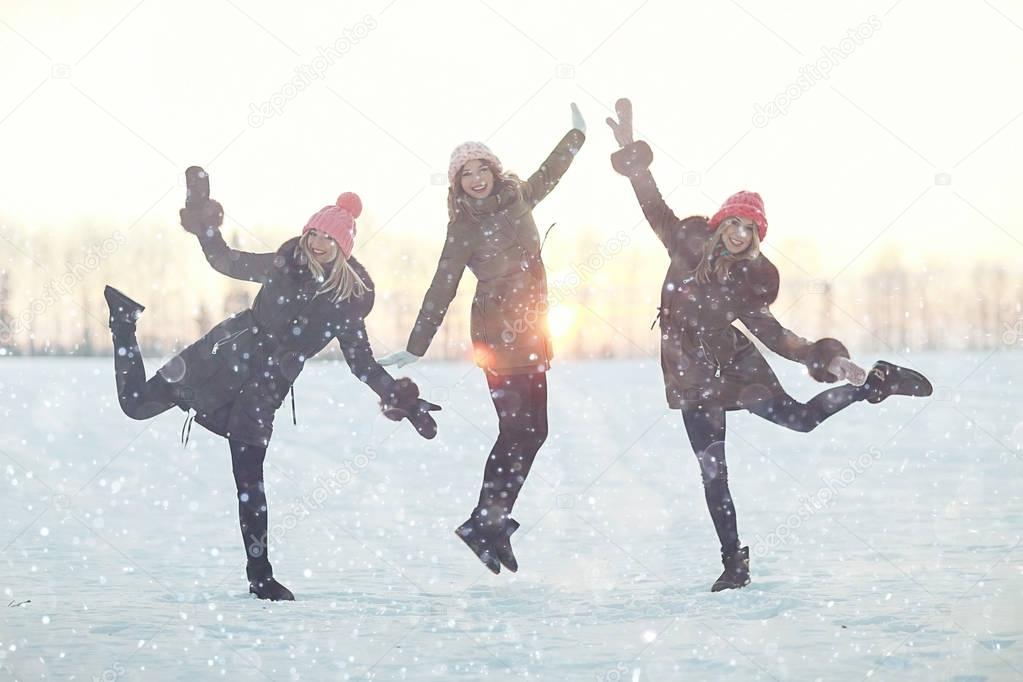 group of girls jumping in winter 