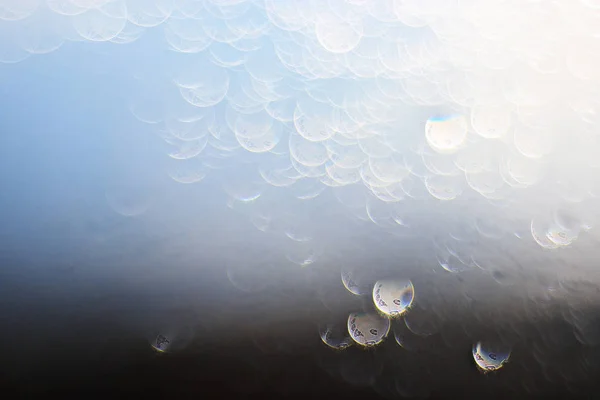 Light bokeh drops on glass — Stock Photo, Image