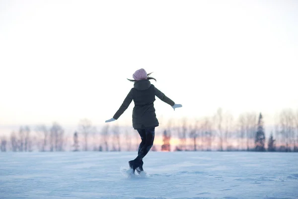 Happy girl at winter snowy field — Stock Photo, Image