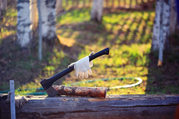 Firewood ax and glove outdoor — Stock Photo, Image