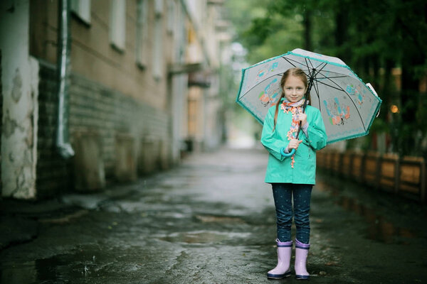 cute girl under Spring rain