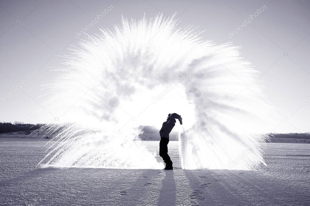 Man making fountain of snow