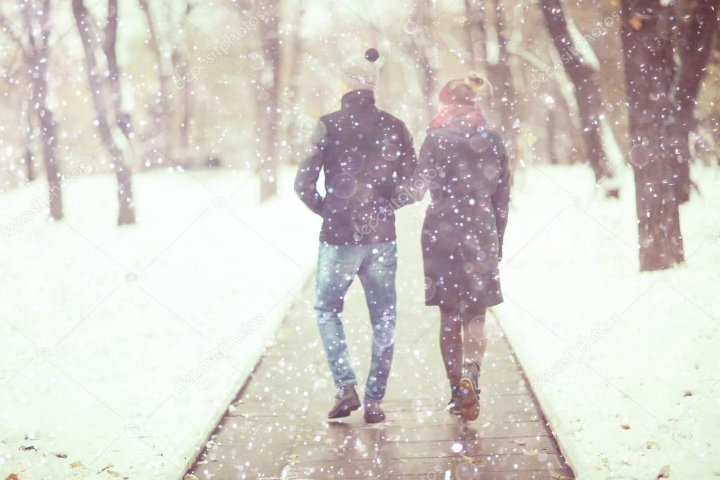 man and woman in a city park