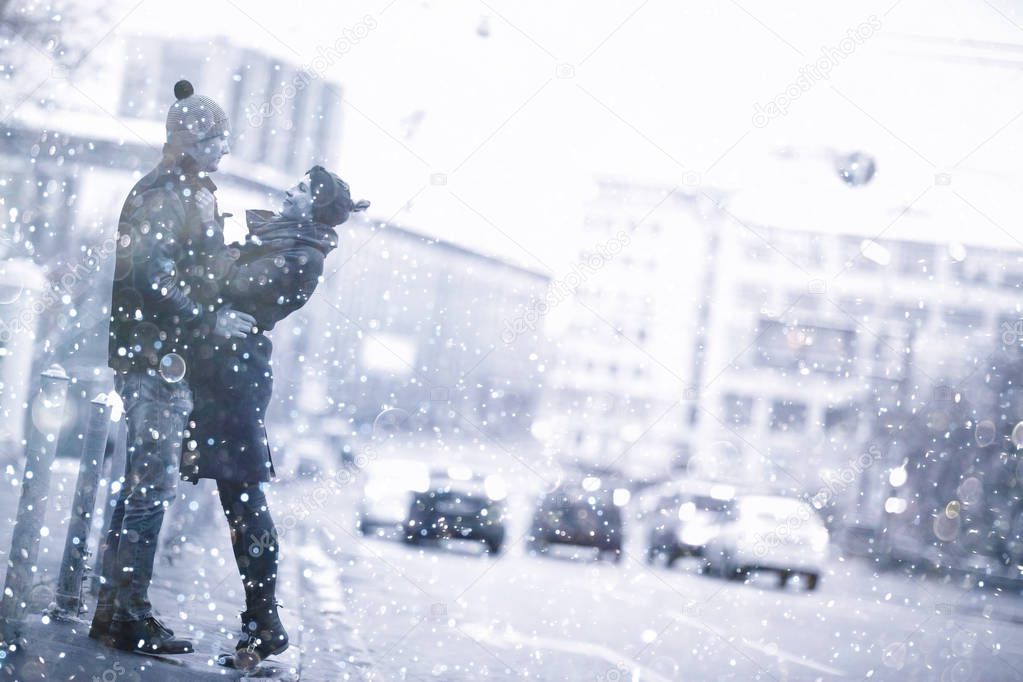 couple on sidewalk of  city