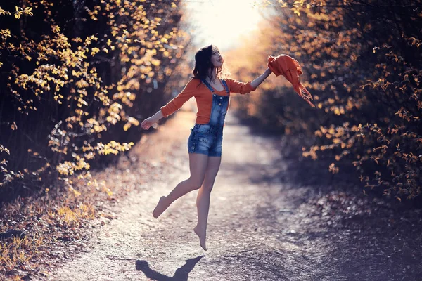 Woman jumping in spring forest — Stock Photo, Image