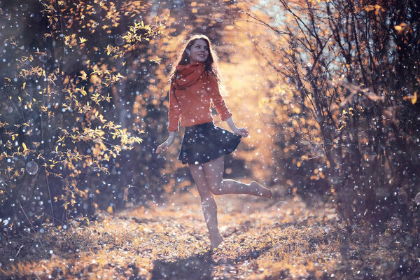 Portrait of cheerful girl in autumn park, outdoor