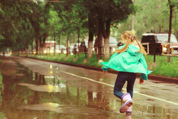 cute girl under Spring rain