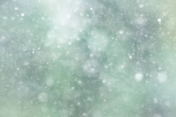 Tekstur dari kepingan salju pada latar belakang buram — Stok Foto