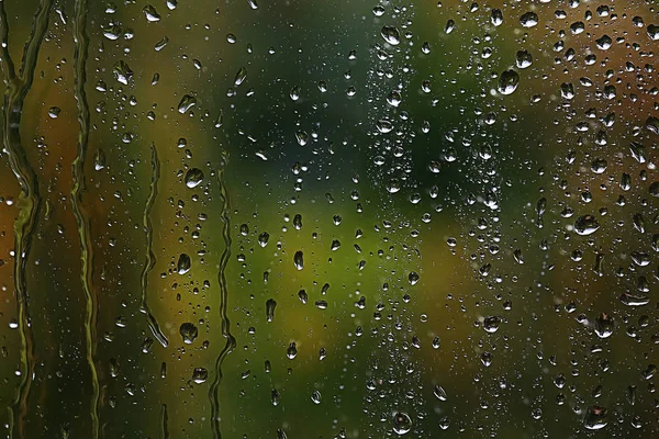 Raindrops flowing  down the glass — Stock Photo, Image