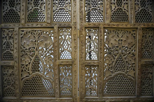 Wooden carved screen near the wall — Stock Photo, Image