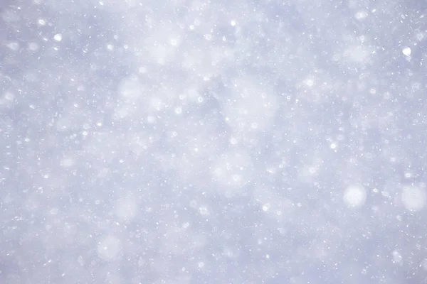 Textura de flocos de neve no fundo embaçado — Fotografia de Stock