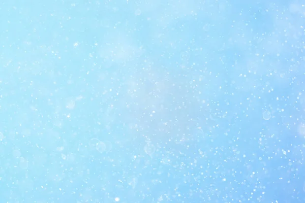 Textur von Schneeflocken auf verschwommenem Hintergrund — Stockfoto