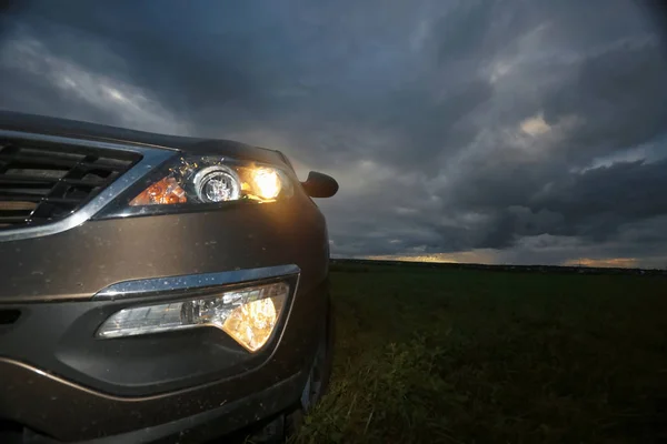 Car on the road in the field — Stock Photo, Image