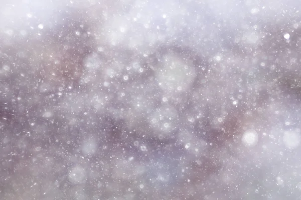 texture of snowflakes on blurry background