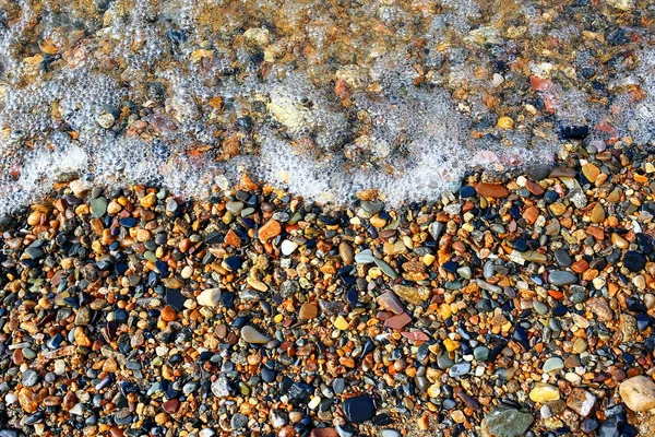 Pebble texture on the river bank — Stock Photo, Image