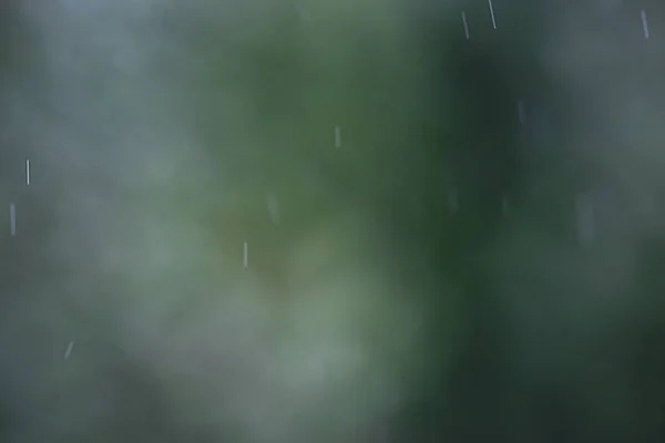 Gotas de lluvia que fluyen por el vidrio —  Fotos de Stock