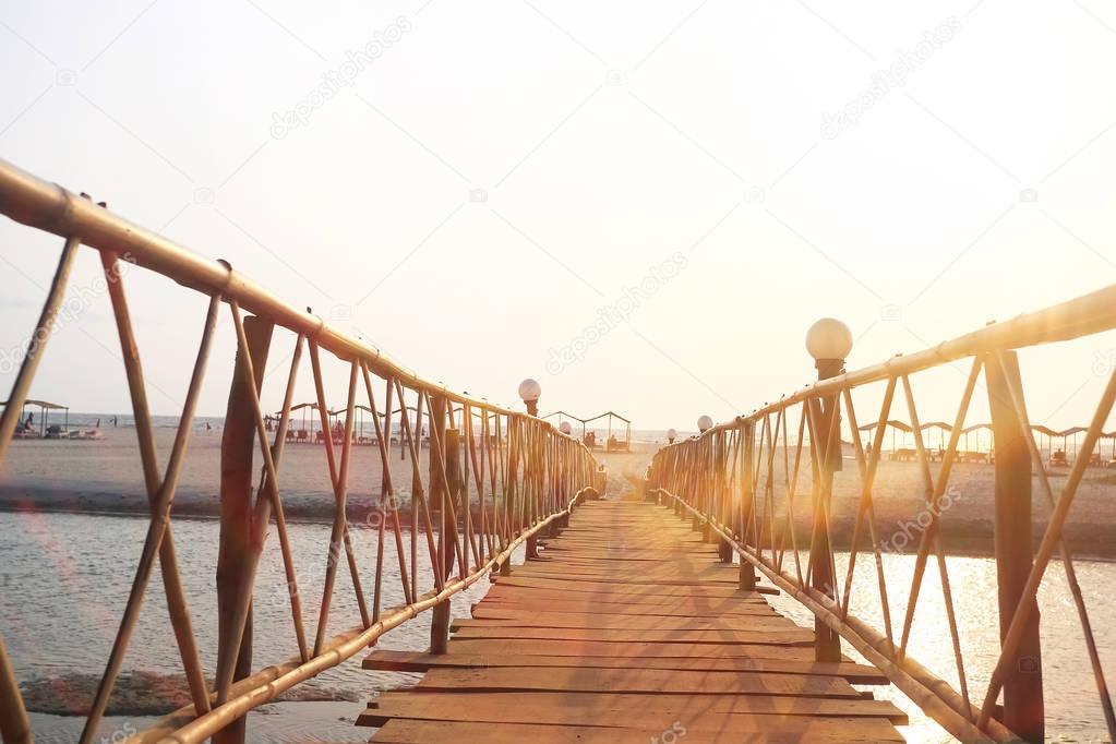 Wooden bridge across the river