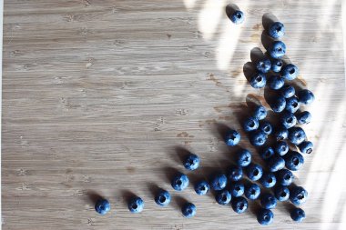 Blueberries lying on the table clipart